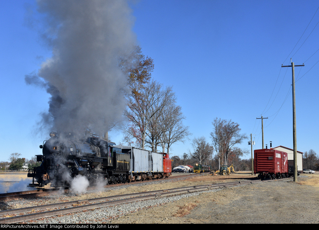 The 0-6-0 9 pushes the very short freight photo charter back to the S. Woodstown station while the diesel charter awaits its assignment in the background 